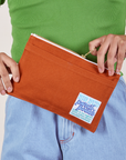 Pencil Pouch in Burnt Terracotta held by model