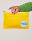 Pencil Pouch in Golden Yellow held by model