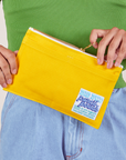 Pencil Pouch in Golden Yellow held by model