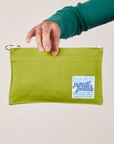 Pencil Pouch in Gross Green held by model