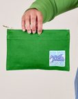 Pencil Pouch in Kelly Green held by model