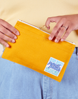 Pencil Pouch in Mustard Yellow held by model