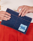 Pencil Pouch in Dark Wash Denim held by model