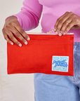 Pencil Pouch in mustang red held by model