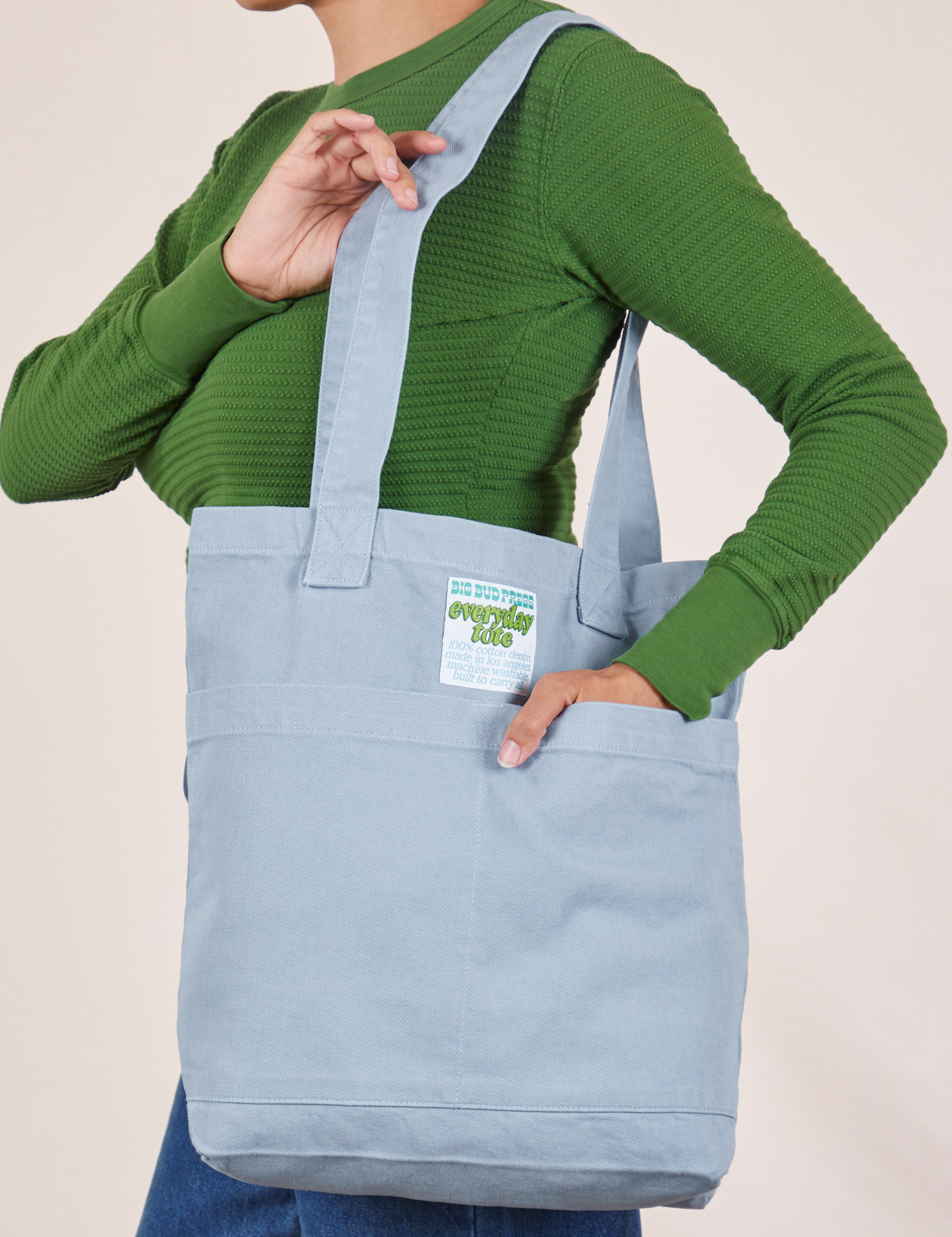 Everyday Tote Bag in Periwinkle worn over shoulder of model