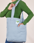 Everyday Tote Bag in Periwinkle worn over shoulder of model