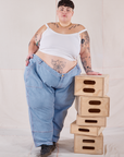 Jordan is wearing Petite Carpenter Jeans in Light Wash and Cropped Cami in vintage tee off-white
