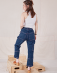Back view of Petite Carpenter Jeans in Dark Wash and Tank Top in vintage tee off-white on Hana