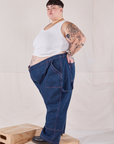 Side view of Petite Carpenter Jeans in Dark Wash and Cropped Tank Top in vintage tee off-white on Jordan