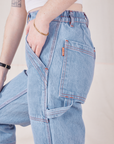 Side view close up of Petite Carpenter Jeans in Light Wash on Hana