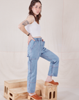 Side view of Petite Carpenter Jeans in Light Wash and Cropped Cami in vintage tee off-white on Hana