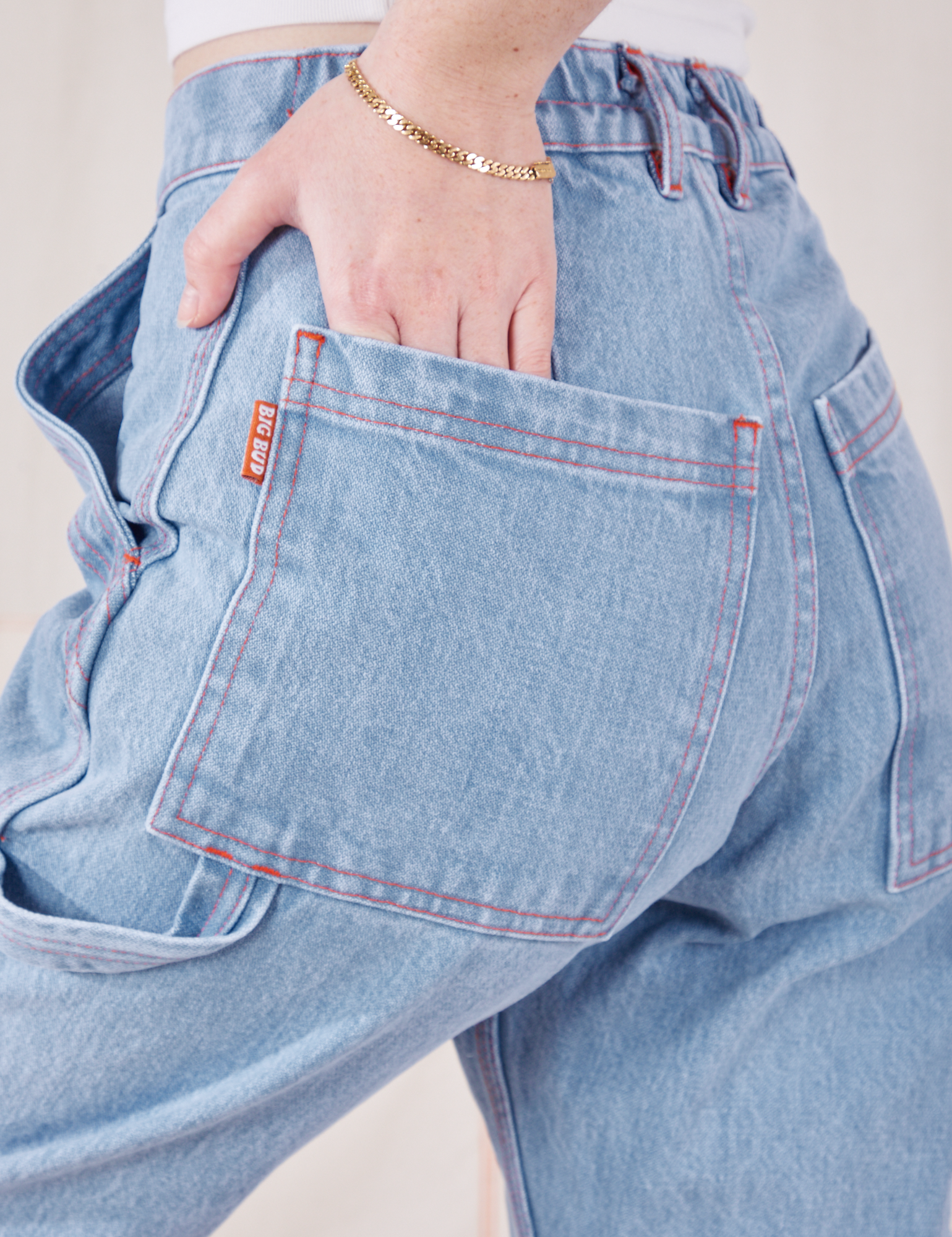 Petite Carpenter Jeans in Light Wash back pocket close up on Hana