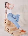 Hana is wearing Petite Carpenter Jeans in Light Wash and Cropped Cami in vintage tee off-white