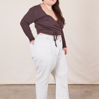 Side view of Western Pants in Vintage Off-White paired with an espresso brown Wrap Top worn by Ashley