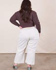 Back view of Western Pants in Vintage Off-White paired with an espresso brown Wrap Top worn by Ashley