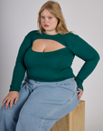 Juliet wearing the Hunter Green Long Sleeve Porthole Tee with Light Wash Denim Wide Leg Trousers