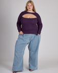 Juliet wearing the Nebula Purple Long Sleeve Porthole Tee with Light Wash Denim Wide Leg Trousers