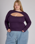 Juliet is 5'7" and wearing L Nebula Purple Long Sleeve Porthole Tee