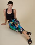 Alex wearing the Rainbow Magic Waters Work Pants with the Black Cropped Tank