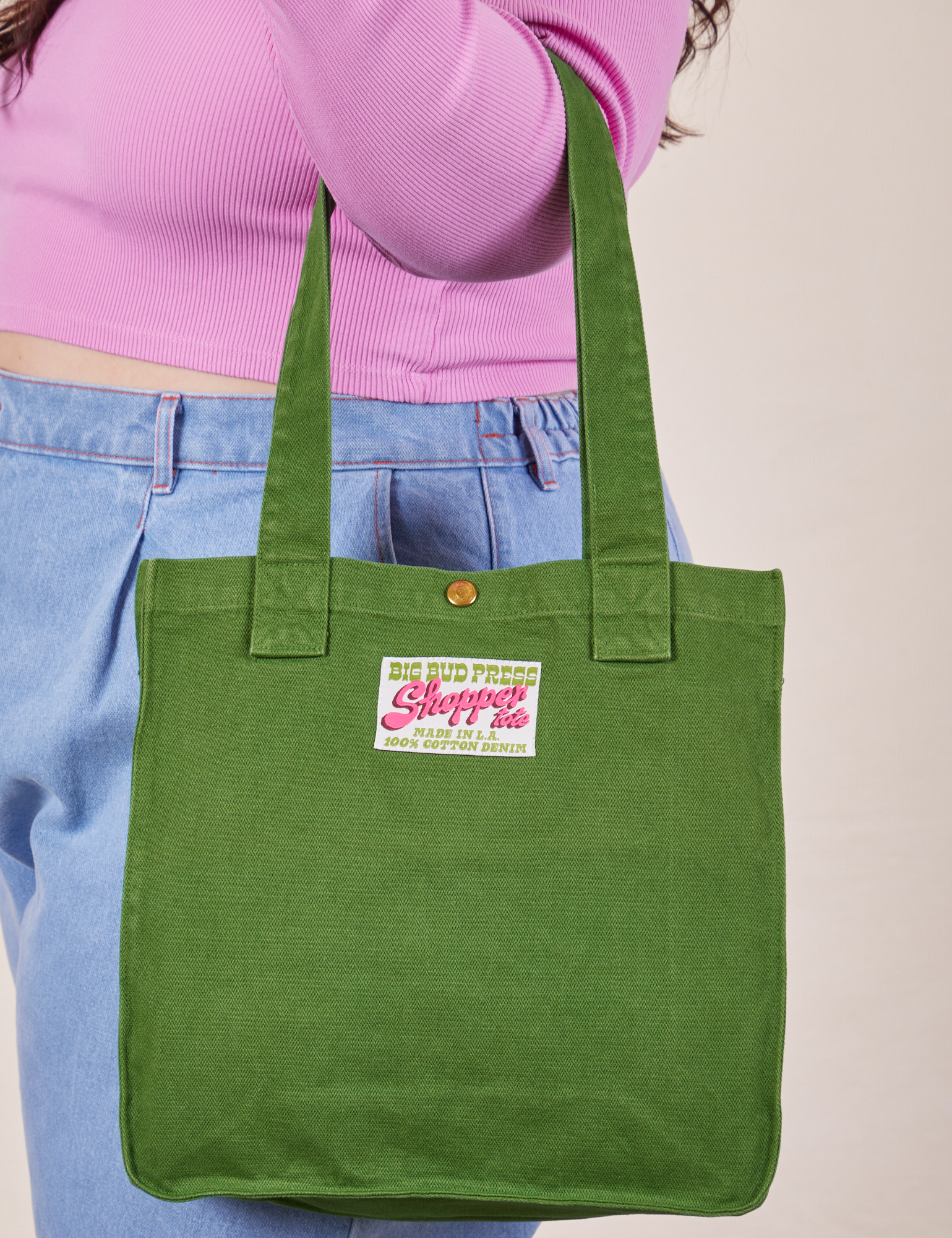 Shopper Tote in Lawn Green on arm of model