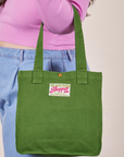 Shopper Tote in Lawn Green on arm of model