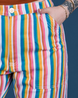 Close up of Sydney's hand in the front pocket of Work Pants in Rainbow Stripe