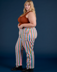 Side view of Work Pants in Rainbow Stripe and burnt terracotta Cropped Tank