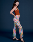 Side view of Work Pants in Rainbow Stripe paired with burnt terracotta Cropped Tank