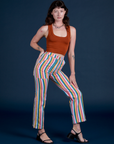 Alex is wearing Work Pants in Rainbow Stripe and burnt terracotta Cropped Tank