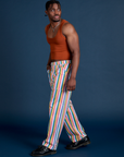 Side view of Work Pants in Rainbow Stripe and burnt terracotta Cropped Tank on Isaac