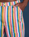 Close up of Isaac's hand in the front pocket of Work Pants in Rainbow Stripe