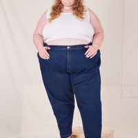 Catie is 5'11" and wearing 4XL Denim Trouser Jeans in Dark Wash