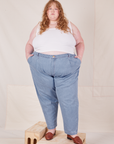 Catie is wearing Denim Trouser Jeans in Light Wash and Cropped Tank Top in vintage tee off-white