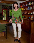 Alex has on the Kitchen Collection Waist Apron