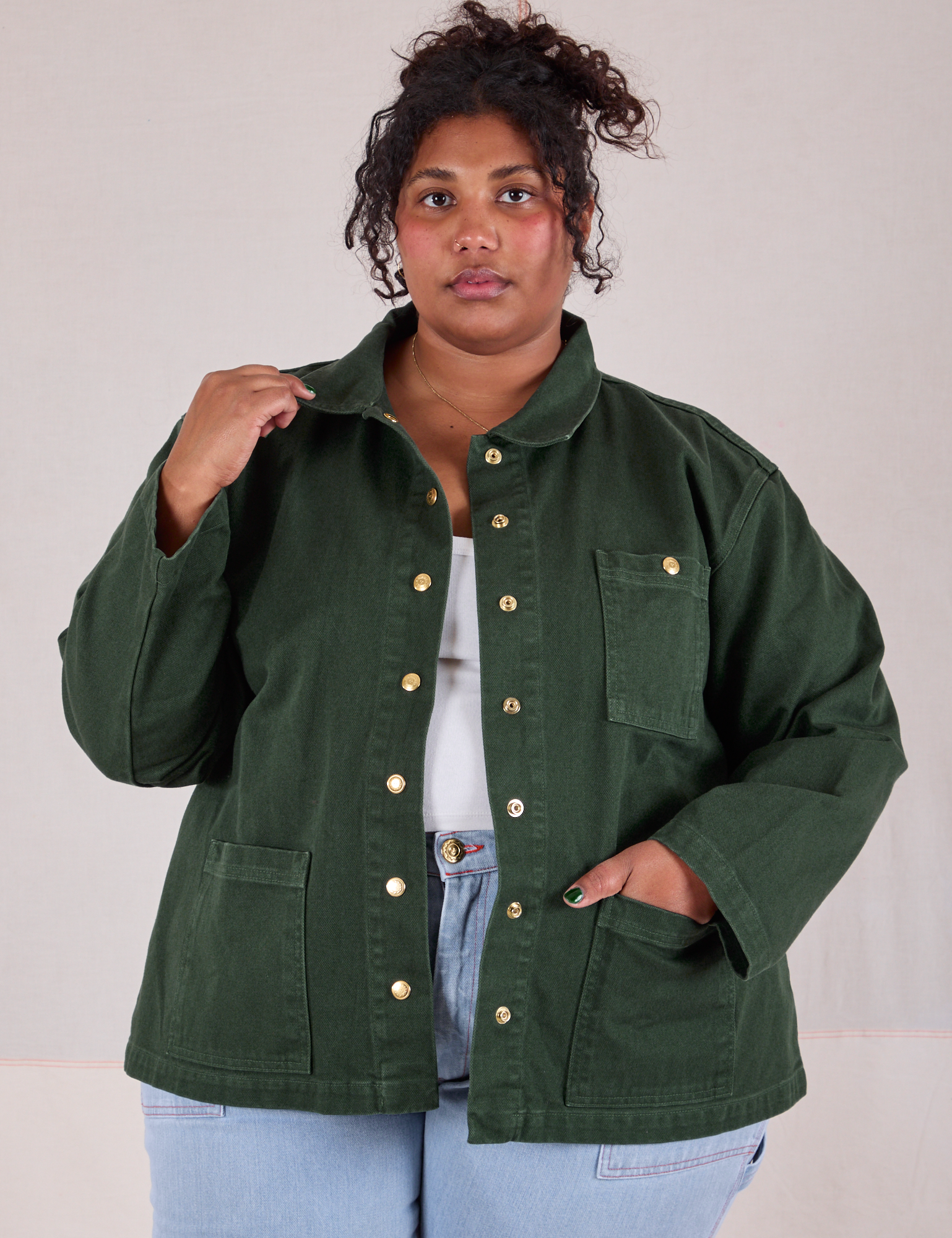 Morgan is 5'5" and wearing 1XL Denim Work Jacket in Swamp Green