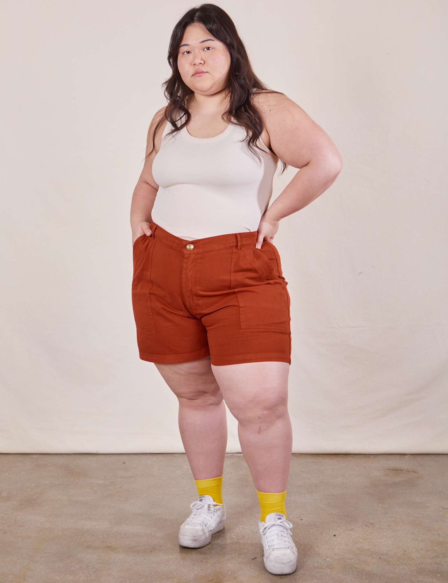 Ashley is wearing Classic Work Shorts in Paprika and Tank Top in vintage tee off-white