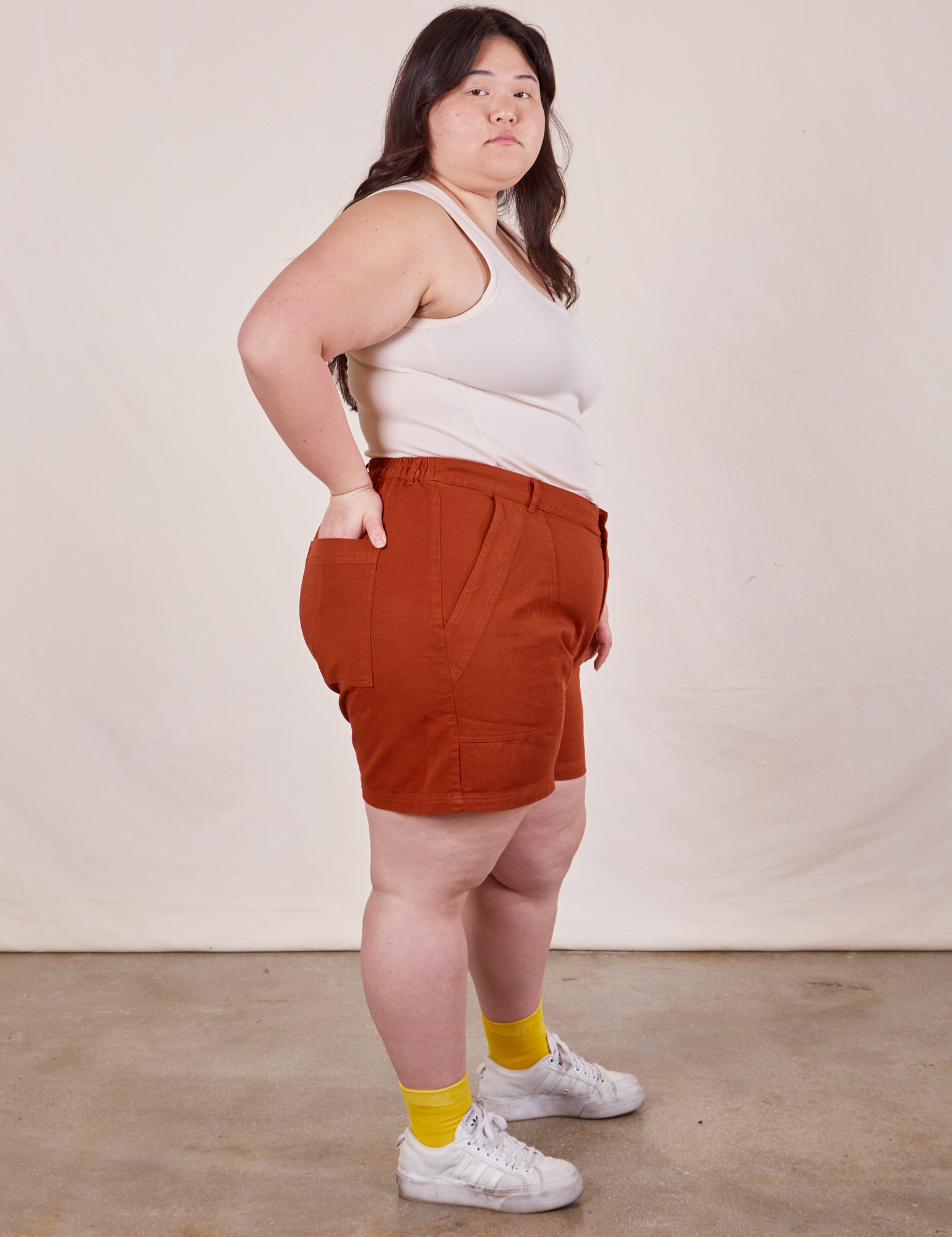 Side view of Classic Work Shorts in Paprika and Tank Top in vintage tee off-white on Ashley