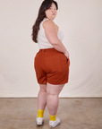Angled back view of Classic Work Shorts in Paprika and Tank Top in vintage tee off-white on Ashley