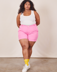 Morgan is wearing Classic Work Shorts in Bubblegum Pink and Tank Top in vintage tee off-white