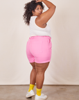 Angled back view of Classic Work Shorts in Bubblegum Pink and Tank Top in vintage tee off-white