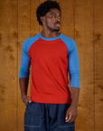 Isaac wearing the Mustang Red/Blue Colorblock Raglan Tee