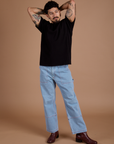 Jesse is 5'8" and wearing S Burly Tee in Basic Black paired with light wash Carpenter Jeans