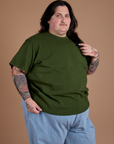 Angled front view of Burly Tee in Evergreen on Sam