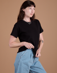 Angled front view of Burly Tee in Basic Black on Alex