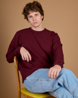 Quinn wearing the Red Wine Long Sleeve Burly Tee