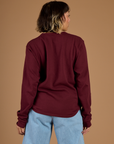 Back view of Tiara in the Red Wine Long Sleeve Burly Tee