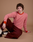 Quinn is wearing Long Sleeve Burly Tee in Red/White Stripe and Drop Pocket Cargo Pants in Red Wine