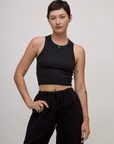 Alex is 5'8" and wearing P Basic Black Deep Cut Racerback