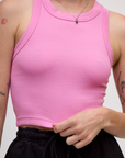 Close up of the the P Bubblegum Pink Deep Cut Racerback on Alex