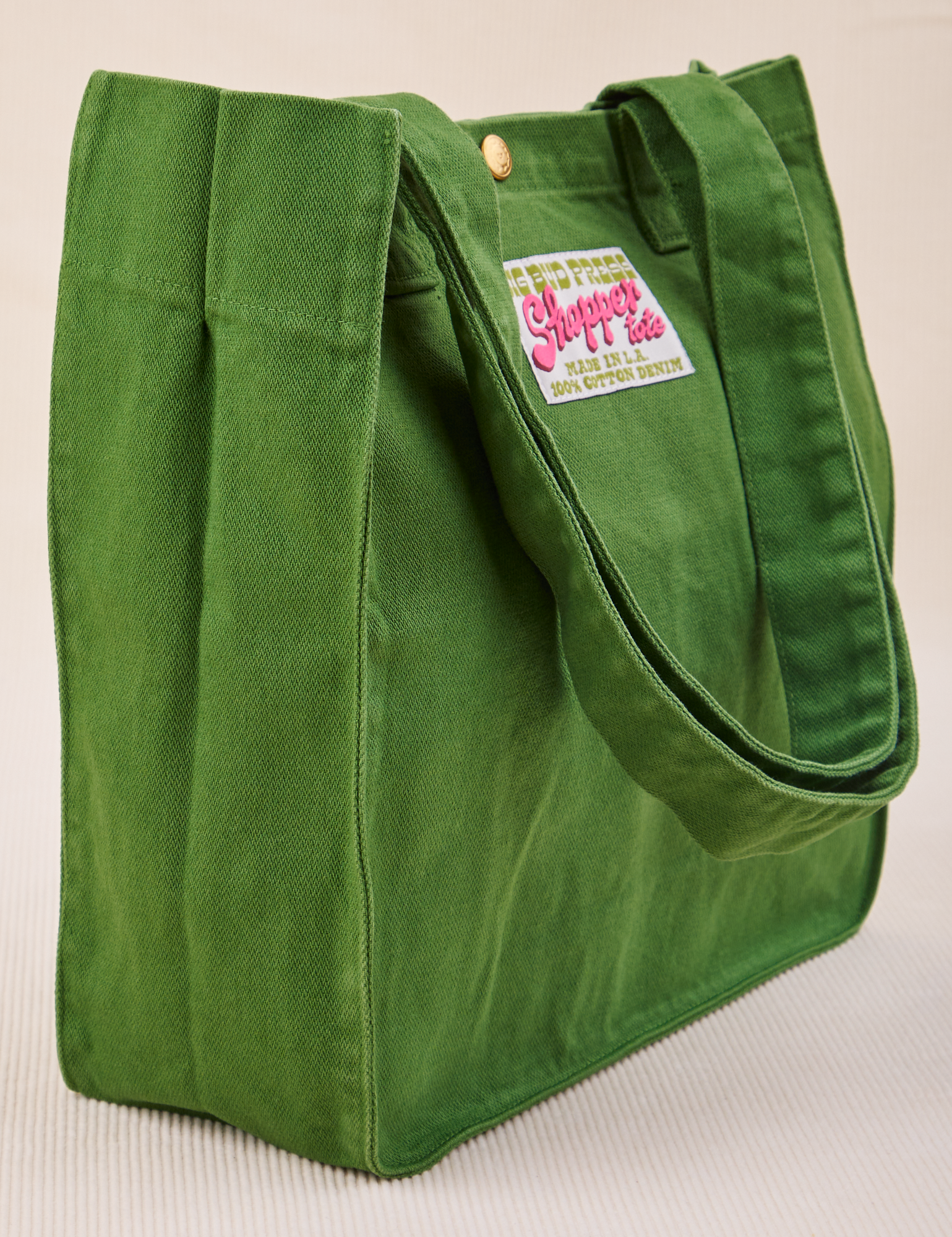 Angled view of lawn green Shopper Tote